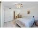 Bedroom with ensuite bathroom access and ceiling fan at 1247 S Martin Luther King Jr Ave # 107, Clearwater, FL 33756