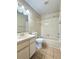 Clean bathroom with a shower/tub combo and updated vanity at 1622 Palm Leaf Dr, Brandon, FL 33510