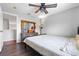 This bedroom offers wood-look flooring and a decorative accent table at 18127 Sandy Pointe Dr, Tampa, FL 33647