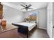 Bright bedroom featuring a ceiling fan and wood-look floors at 18127 Sandy Pointe Dr, Tampa, FL 33647