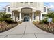 Beautiful clubhouse entrance featuring stone columns, lush landscaping and a no parking sign at 18127 Sandy Pointe Dr, Tampa, FL 33647