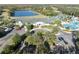 Elegant clubhouse surrounded by lush landscaping, a pool, and parking, creating a welcoming community hub at 18127 Sandy Pointe Dr, Tampa, FL 33647