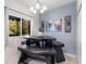 Inviting dining area with natural light and a view, featuring an unusual picnic-style dining table at 18127 Sandy Pointe Dr, Tampa, FL 33647