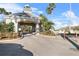 Community Entrance with palm trees and stone gate at 18127 Sandy Pointe Dr, Tampa, FL 33647