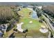 Picturesque golf course with manicured greens, sand traps, and a serene lake, offering a challenging and enjoyable game at 18127 Sandy Pointe Dr, Tampa, FL 33647