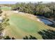 Elevated view of a manicured putting green at 18127 Sandy Pointe Dr, Tampa, FL 33647