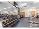 Well-equipped gym featuring multiple machines, free weights, mirrors, and a mounted TV at 18127 Sandy Pointe Dr, Tampa, FL 33647