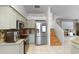 Well-equipped kitchen features stainless steel appliances, granite counters, and a staircase nearby at 18127 Sandy Pointe Dr, Tampa, FL 33647