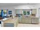 Charming kitchen featuring granite counters, stainless steel appliances, and stylish tile backsplash at 18127 Sandy Pointe Dr, Tampa, FL 33647