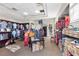 View of the pro shop with neat rows of shirts, shoes, and golf equipment for sale at 18127 Sandy Pointe Dr, Tampa, FL 33647