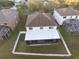 Aerial view of a home showcasing a fenced yard with a screened-in patio at 18127 Sandy Pointe Dr, Tampa, FL 33647