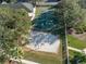 Overhead view of sports courts including a basketball court and sand volleyball court, perfect for community recreation at 18127 Sandy Pointe Dr, Tampa, FL 33647