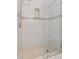 Clean bathroom with tiled shower and glass enclosure at 201 W Laurel St # 503, Tampa, FL 33602