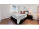 Second bedroom with a full-size bed and hardwood floors at 201 W Laurel St # 503, Tampa, FL 33602