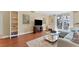 Living room features hardwood floors, sectional sofa, and built-in shelving at 201 W Laurel St # 503, Tampa, FL 33602