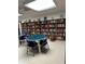 Community library with bookshelves and seating area at 2505 Oakleaf Ln # 24C, Clearwater, FL 33763