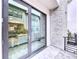 Private balcony with glass doors and brick wall at 2511 N Grady N Ave # 59, Tampa, FL 33607