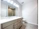 Modern bathroom with double sinks, toilet and shower at 2511 N Grady N Ave # 59, Tampa, FL 33607