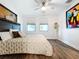 Spacious bedroom with large windows, ceiling fan, and wood floors at 2511 N Grady N Ave # 59, Tampa, FL 33607