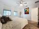 Spacious bedroom with large windows, ceiling fan, and wood floors at 2511 N Grady N Ave # 59, Tampa, FL 33607
