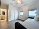 Bedroom with daybed, wood floors and access to a bathroom at 2511 N Grady N Ave # 59, Tampa, FL 33607
