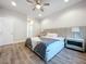 Bright bedroom with large bed, wood floors, and ceiling fan at 2511 N Grady N Ave # 59, Tampa, FL 33607