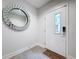 Bright entryway with tiled floors, large mirror, and modern door at 2511 N Grady N Ave # 59, Tampa, FL 33607
