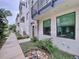 Townhouse exterior with walkway, landscaping, and private entrance at 2511 N Grady N Ave # 59, Tampa, FL 33607