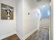 Clean hallway with hardwood floors and modern art at 2511 N Grady N Ave # 59, Tampa, FL 33607