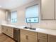 Modern kitchen with stainless steel appliances and light beige cabinets at 2511 N Grady N Ave # 59, Tampa, FL 33607