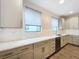 Modern kitchen with white quartz countertops and gray cabinets at 2511 N Grady N Ave # 59, Tampa, FL 33607