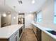 Modern kitchen with stainless steel appliances and white cabinets at 2511 N Grady N Ave # 59, Tampa, FL 33607