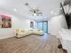 Open concept living area with hardwood floors and sectional sofa at 2511 N Grady N Ave # 59, Tampa, FL 33607