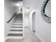 Modern staircase with wood steps and dark metal railing at 2511 N Grady N Ave # 59, Tampa, FL 33607