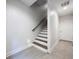 Clean and modern staircase with wood and white risers at 2511 N Grady N Ave # 59, Tampa, FL 33607