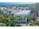 Aerial view of a modern home with a flat roof and a beautiful backyard at 2711 W Trilby Ave, Tampa, FL 33611