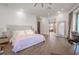 Luxurious main bedroom with hardwood floors and ensuite bathroom at 2711 W Trilby Ave, Tampa, FL 33611