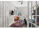Office space with french doors, natural light, shelving, and workspace with a desk at 340 1St N St # I, St Petersburg, FL 33701