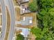 An aerial view showcasing a house nestled amongst trees near a waterway at 3451 Seven Springs Blvd, New Port Richey, FL 34655