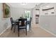 Dining area with dark wood table and chairs, kitchen view at 3451 Seven Springs Blvd, New Port Richey, FL 34655