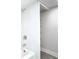 Clean bathroom with shower/tub combo and shelving at 400 Island Way # 1411, Clearwater Beach, FL 33767