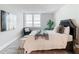 Well-lit bedroom with city view, a bed, and a chair at 400 Island Way # 1411, Clearwater Beach, FL 33767