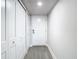 Bright entryway with white closets and wood-look floors at 400 Island Way # 1411, Clearwater Beach, FL 33767