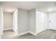 White hallway with light grey floors and multiple doors at 400 Island Way # 1411, Clearwater Beach, FL 33767