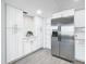White kitchen with stainless steel appliances and ample storage at 400 Island Way # 1411, Clearwater Beach, FL 33767