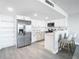 Modern white kitchen with stainless steel appliances at 400 Island Way # 1411, Clearwater Beach, FL 33767