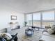 Spacious living room with floor-to-ceiling windows and stunning water views at 400 Island Way # 1411, Clearwater Beach, FL 33767