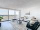 Bright living room with city views, comfy seating, and a stylish coffee table at 400 Island Way # 1411, Clearwater Beach, FL 33767
