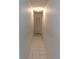 Long hallway with tile floor and doors to bedrooms at 415 Bloomingfield Dr, Brandon, FL 33511