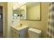 Clean bathroom with single sink vanity, toilet, and shower at 4544 101St N Ter, Pinellas Park, FL 33782